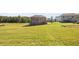 Large backyard with green grass and a view of neighboring homes at 175 Barclay Dr, Mcdonough, GA 30252