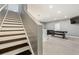 Basement stairs with dark wood and white risers at 175 Barclay Dr, Mcdonough, GA 30252