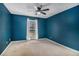 Bright bedroom featuring a ceiling fan and neutral carpeting at 2619 Vinings Central Se Dr, Atlanta, GA 30339