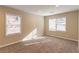 Well-lit bedroom with neutral walls and carpet flooring at 3152 Bay St, Scottdale, GA 30079