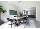 Open concept dining room with kitchen view, features a long wooden table with black chairs at 81 Telfair Ct, Acworth, GA 30101