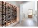 Custom wine cellar with brick wall and metal racking, perfect for wine enthusiasts at 81 Telfair Ct, Acworth, GA 30101