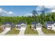New homes community, featuring multiple houses with lush green lawns and tree-lined streets at 540 Whitman Ln, Stockbridge, GA 30281