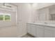 Double vanity bathroom with a view into a bedroom at 540 Whitman Ln, Stockbridge, GA 30281