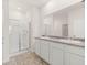 Double vanity bathroom with a large mirror and a walk-in shower at 540 Whitman Ln, Stockbridge, GA 30281