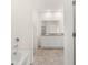 Bathroom with double vanity and a soaking tub, offering a relaxing retreat at 540 Whitman Ln, Stockbridge, GA 30281