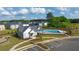 Aerial view of community pool, clubhouse, and surrounding landscape at 540 Whitman Ln, Stockbridge, GA 30281