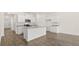 Modern kitchen featuring white cabinets, granite countertops, and hardwood floors at 540 Whitman Ln, Stockbridge, GA 30281