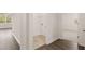 Laundry area with tile flooring and built in shelving at 540 Whitman Ln, Stockbridge, GA 30281