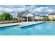 Community pool with adjacent clubhouse and lounge area at 540 Whitman Ln, Stockbridge, GA 30281