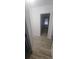 Light hallway with wood-look flooring leading to bedroom and bathroom at 2103 Arlington Nw Cir, Atlanta, GA 30318