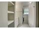 Updated bathroom with built-in shelving, stackable washer/dryer, and shower at 3149 Buford Ne Hwy # 7, Atlanta, GA 30329