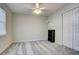 Well-lit bedroom featuring neutral wall paint and carpet at 3149 Buford Ne Hwy # 7, Atlanta, GA 30329