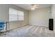 Bedroom with window, ceiling fan, and neutral carpeting at 3149 Buford Ne Hwy # 7, Atlanta, GA 30329
