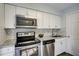 Updated kitchen with stainless steel appliances and granite countertops at 3149 Buford Ne Hwy # 7, Atlanta, GA 30329