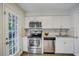 Updated kitchen features stainless steel appliances and granite countertops at 3149 Buford Ne Hwy # 7, Atlanta, GA 30329