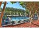 Community pool with lounge chairs and surrounding landscaping at 3149 Buford Ne Hwy # 7, Atlanta, GA 30329