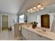 Main bathroom with double vanity, large mirror, and separate tub at 2943 Salem Oak Way, Duluth, GA 30096