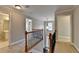 Upstairs hallway with carpet, light fixtures and railing at 2943 Salem Oak Way, Duluth, GA 30096