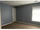 Simple bedroom with grey walls and carpet flooring at 6005 Pattingham Dr, Roswell, GA 30075