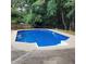 Inviting in-ground pool surrounded by a wooden deck at 6005 Pattingham Dr, Roswell, GA 30075