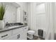 Clean bathroom with white vanity, granite countertop, and tub shower combo at 316 Rodeo Dr, Auburn, GA 30011