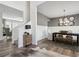 Elegant dining room features a rustic table, chandelier, and hardwood floors at 316 Rodeo Dr, Auburn, GA 30011