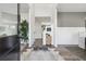 Bright entry hall with hardwood floors, view of dining room and staircase at 316 Rodeo Dr, Auburn, GA 30011