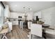 Modern kitchen with white cabinets, granite counters, and stainless steel appliances at 316 Rodeo Dr, Auburn, GA 30011