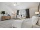 Spacious main bedroom with high ceilings, plush carpeting, and ample natural light at 316 Rodeo Dr, Auburn, GA 30011
