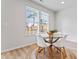 Bright dining area with glass table and four white chairs at 2799 Aralynn Way, College Park, GA 30337