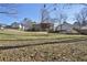 Large backyard with view of house and screened porch at 3235 Stanford Cir, Lawrenceville, GA 30044