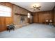 Finished basement with brick fireplace and wood paneling at 3235 Stanford Cir, Lawrenceville, GA 30044