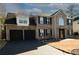 Two-story house with a two-car garage, brick and siding exterior, and landscaping at 2074 Mulberry Ln, Lithonia, GA 30058