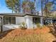 White brick ranch home with modern black windows and landscaping at 2861 Sylvan Rd, Atlanta, GA 30344