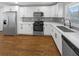 Updated kitchen featuring white cabinets and stainless steel appliances at 2861 Sylvan Rd, Atlanta, GA 30344