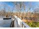 Deck with table and chairs overlooking a peaceful pond at 416 Ebenezer Church Rd, Fayetteville, GA 30215