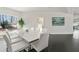 Elegant dining room with large table, white chairs, and hardwood floors at 416 Ebenezer Church Rd, Fayetteville, GA 30215