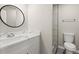 Modern bathroom with quartz vanity and shower at 576 Rockwell Sw St, Atlanta, GA 30310
