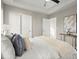 Bright bedroom with plush carpet, neutral walls, and ample closet space at 576 Rockwell Sw St, Atlanta, GA 30310
