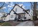 Two-story house with a white exterior, gray accents, and a spacious front yard at 576 Rockwell Sw St, Atlanta, GA 30310