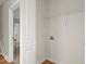 Laundry closet with shelving and hookups for a washer and dryer at 576 Rockwell Sw St, Atlanta, GA 30310