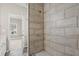 Clean bathroom with a large walk-in shower and neutral tile at 576 Rockwell Sw St, Atlanta, GA 30310