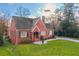 Red brick house with gray roof, landscaping, and driveway at 711 E Ponce De Leon Ave, Decatur, GA 30030