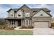 Two story house with brick and siding exterior, large windows, and a two car garage at 3730 Sierra Lake Dr, Cumming, GA 30040