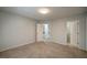 Upstairs bedroom with carpet and access to a hallway bathroom at 3563 Brenda Ct, Douglasville, GA 30135