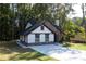 Eye-catching home with stone and white accents, nestled among trees at 3563 Brenda Ct, Douglasville, GA 30135