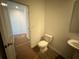 Clean bathroom with sink, toilet and access to another room at 7260 Eton Ln, Locust Grove, GA 30248