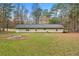 Large backyard with fire pit and plenty of green space at 3361 Highway 3 N, Hampton, GA 30228