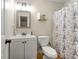 Clean bathroom with white vanity, toilet and shower/tub combo at 3361 Highway 3 N, Hampton, GA 30228